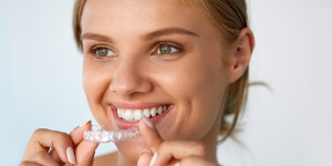 woman with a clear aligner tray